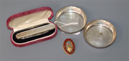 A pair of George VI small silver dishes, Goldsmiths & Silversmiths Co Ltd, London, 1946, a silver and mother of pearl fruit knife etc.